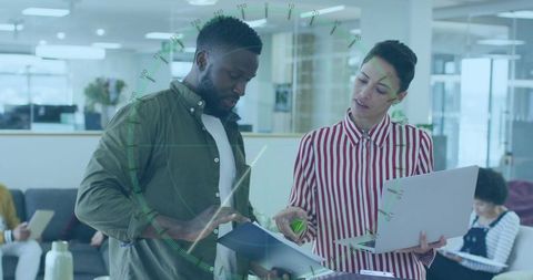 Collaborative office team meeting with technology integration