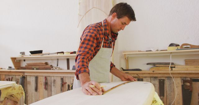 Carpenter Crafting Wooden Surfboard in Workshop - Download Free Stock Images Pikwizard.com