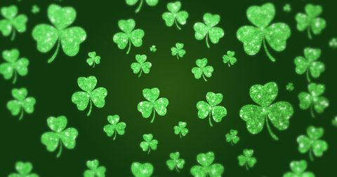 Shimmering Green Shamrocks Falling on Dark Green Background