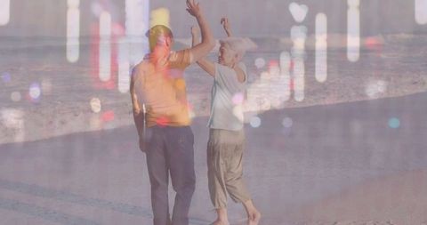 Couple Dancing on Serene Beach at Sunset with Light Overlays