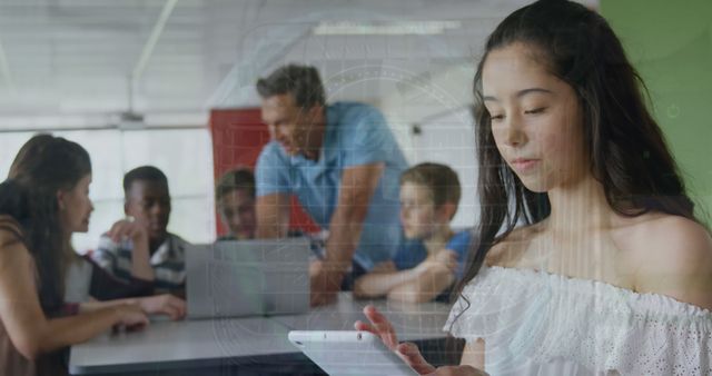 Teen Girl Using Tablet in Classroom with Teacher and Students - Download Free Stock Images Pikwizard.com