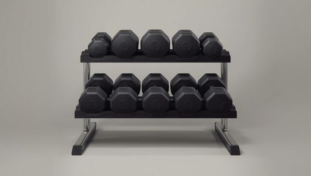 Organized dumbbell rack with hexagonal weights in minimalist gym setting
