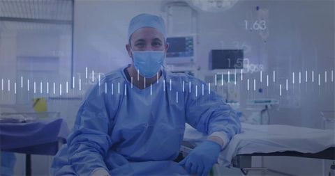 Surgeon preparing for surgery in sterile operating room with medical equipment