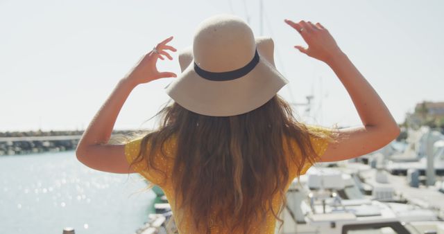 Woman in Yellow Dress and Summer Hat at Marina - Download Free Stock Images Pikwizard.com