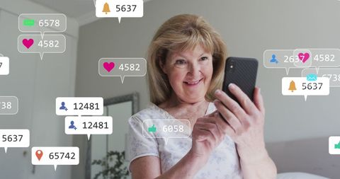 Senior Woman Engaging with Social Media Notifications on Smartphone