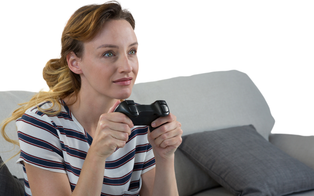 Young Woman Showing Focus While Playing Video Game on Sofa with Transparency - Download Free Stock Videos Pikwizard.com