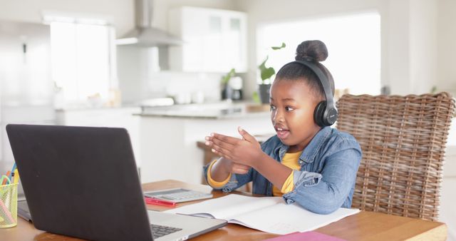 Young African American Girl Learning Online with Headphones at Home - Download Free Stock Images Pikwizard.com