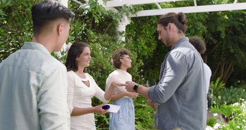 Outdoor wedding celebration with guests enjoying event