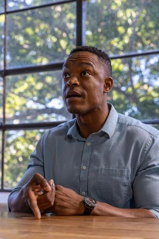 Professional African American Man Engaging Conversation