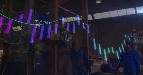 Technicians operating lathe with chart analysis overlays in factory