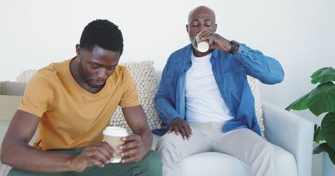 African American Friends Relaxing at Home with Coffee