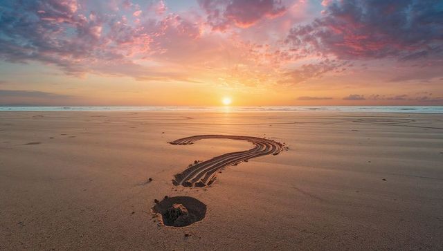 Question Mark Pattern on Beach at Sunrise Reflects Concepts of Mystique and Curiosity