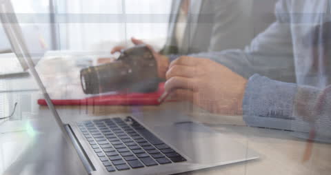 Businessman Networking on Laptop with Blurred City Overlay