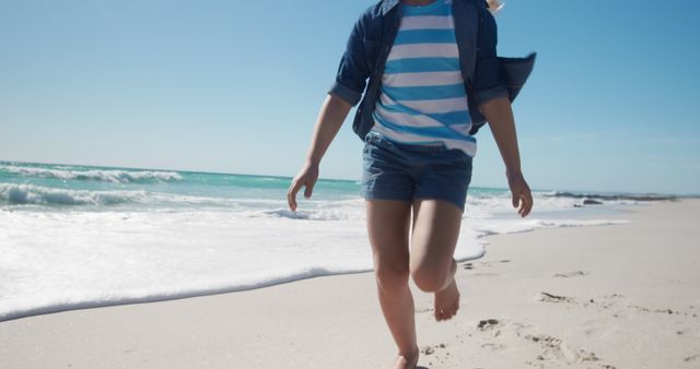 Young Girl Running on Sunny Beach - Download Free Stock Images Pikwizard.com