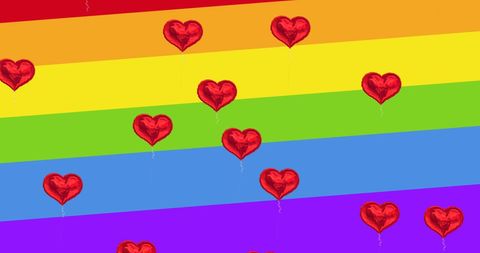 Floating Red Hearts on Vibrant Rainbow Background Celebrating Pride