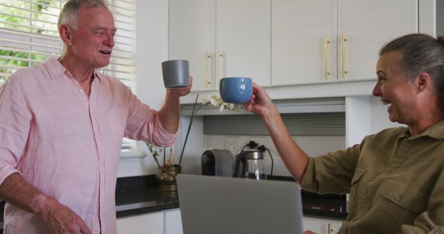 Happy Seniors Drinking Coffee in Kitchen and Smiling - Download Free Stock Images Pikwizard.com