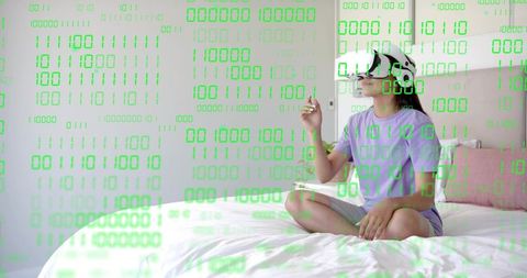 Woman Wearing VR Headset on Bed Interacting with Virtual Binary Interface for Home VR