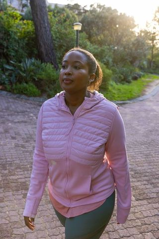 African American Woman Enjoying Morning Walk in Park