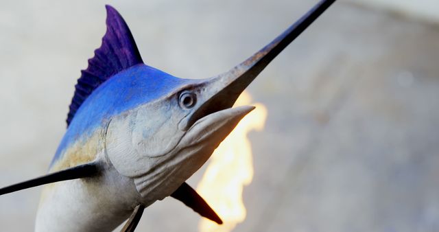 This image captures an up-close view of a majestic swordfish, known for its distinctive sharp bill. The blue and purple hues on its body add to its stunning appearance. Ideal for educational content on marine biology, ocean conservation campaigns, or articles about marine wildlife.