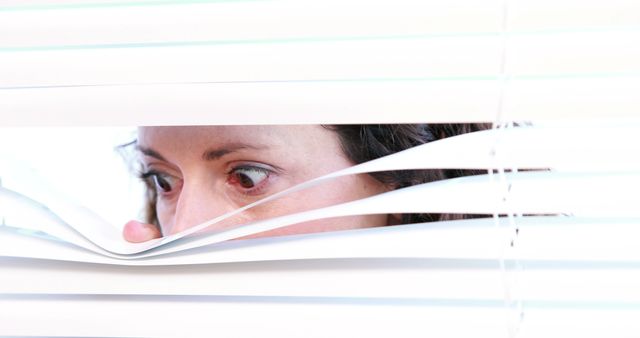 Woman Peeking Through Window Blinds, Curious Expression - Download Free Stock Images Pikwizard.com