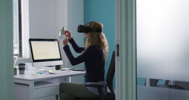 Woman Using Virtual Reality Headset in Modern Office Workspace - Download Free Stock Images Pikwizard.com