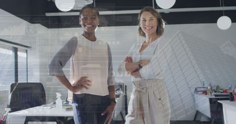 Confident Businesswomen in Office with Digital Financial Overlay