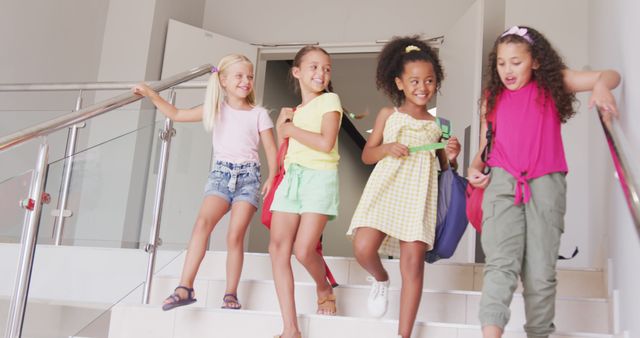 Diverse Group of Happy Girls with Backpacks Leaving School - Download Free Stock Images Pikwizard.com