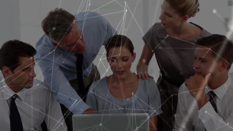 Business Team Analyzing Laptop Data with Network Connections Overlay