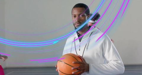 Young Coach Holding Basketball Prepared for Mentoring Session