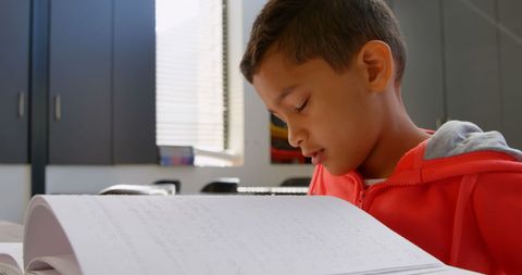 Blind Asian Schoolboy Reading Braille in Classroom Setting - Download Free Stock Images Pikwizard.com