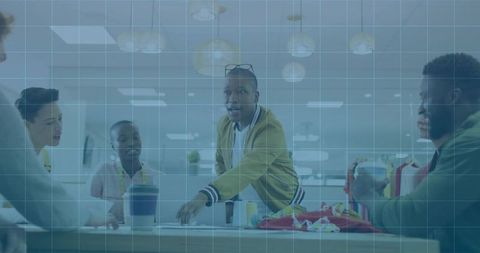 Diverse team engaging in active office meeting for business strategy