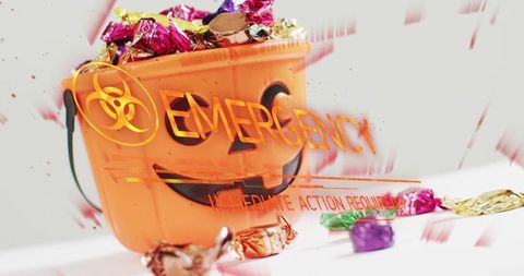 Biohazard Halloween Candy Bucket with Spilling Foil Treats and Emergency Warning