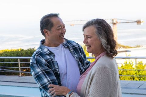 Senior Couple Embracing Near Ocean View