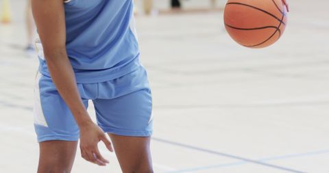 Male Basketball Player Dribbling in Training Session Indoors