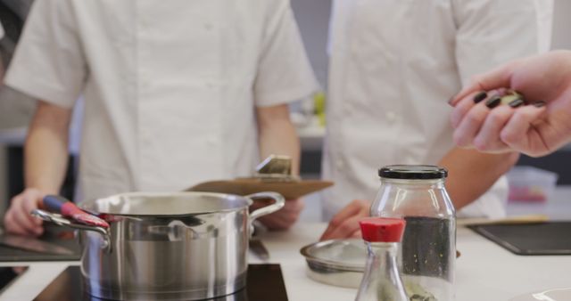 Professional Chefs Cooking in Modern Kitchen with Utensils and Ingredients - Download Free Stock Images Pikwizard.com