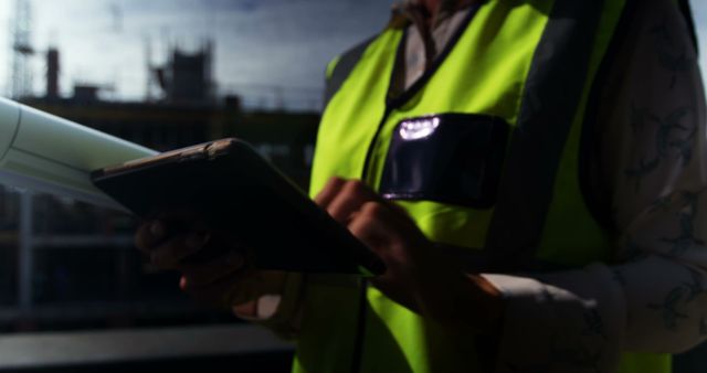 Female Architect Using Digital Tablet on Construction Site - Download Free Stock Images Pikwizard.com