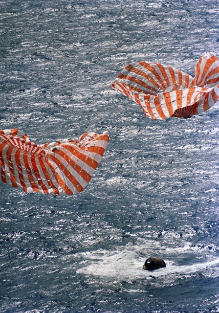 S71-19472 (9 Feb. 1971) --- The Apollo 14 Command Module (CM) splashes down and two of its three main parachutes can be seen collapsing, as the 10-day mission comes to a safe and successful end. The Apollo 14 spacecraft, with astronauts Alan B. Shepard Jr., commander; Stuart A. Roosa, command module pilot; and Edgar D. Mitchell, lunar module pilot, aboard, splashed down at 3:04:39 p.m. (CST) approximately 765 nautical miles southeast of American Samoa.