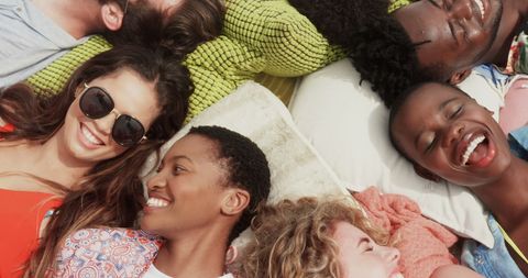 Diverse Friends Relaxing Outdoors and Sharing Laughter