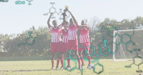 Women soccer team lifting trophy celebrating championship victory on sunny field