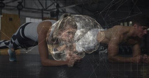 Couple performing forearm plank with digital brain hologram representing focus and fitness