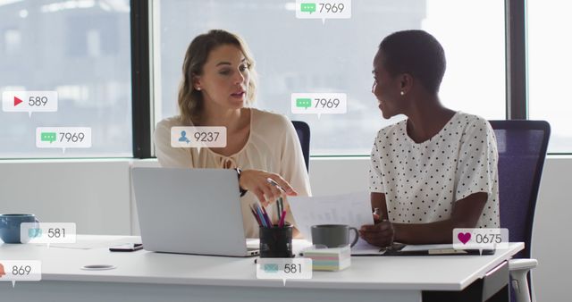 Diverse Businesswomen Discussing Documents in Modern Office with Social Media Icons - Download Free Stock Images Pikwizard.com