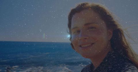 Woman Smiling by Ocean during Sunny Day Adventure