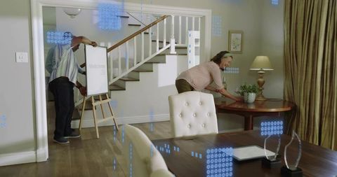 Staging home entryway with welcome easel, arranging furniture and decor