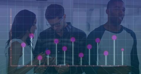 Business Team Analyzing Graph with Technology in Modern Office