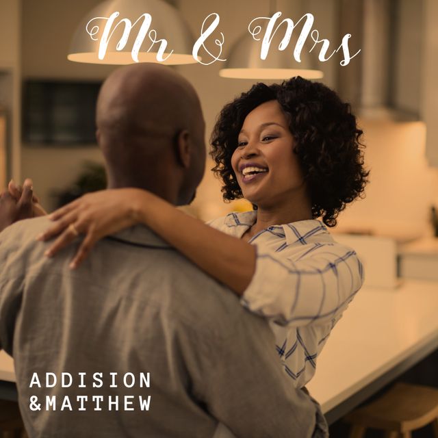 This photo portrays a joyful couple dancing in their kitchen, showcasing their love and the happiness in their relationship. Ideal for use in campaigns promoting love, relationships, and home life. Could be used in blogs about marriage, advertisements for home products, or social media posts celebrating love and togetherness.