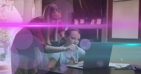 Mother Guiding Young Daughter with Homework