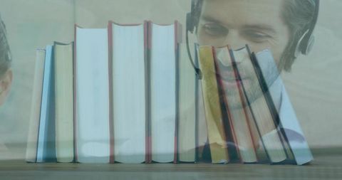 Double exposure hardcover books with smiling man and baby faces for e-learning and reading concept