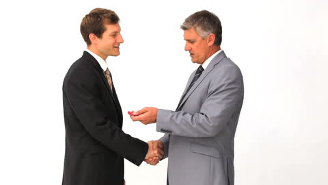 Businessmen Shaking Hands During Exchange