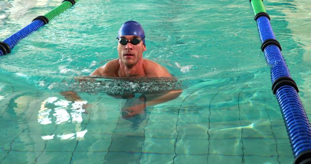 Male Swimmer Wearing Swim Cap and Goggles in Indoor Swimming Pool - Download Free Stock Images Pikwizard.com