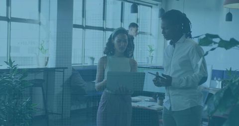 Team Collaboration Discussing Ideas in Modern Office